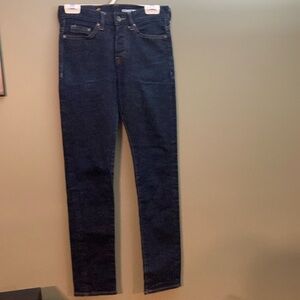 H&M & denim dark blue women's jeans with a distressed look on the front.